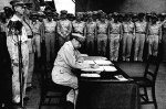 General MacArthur signs the Japanese surrender document